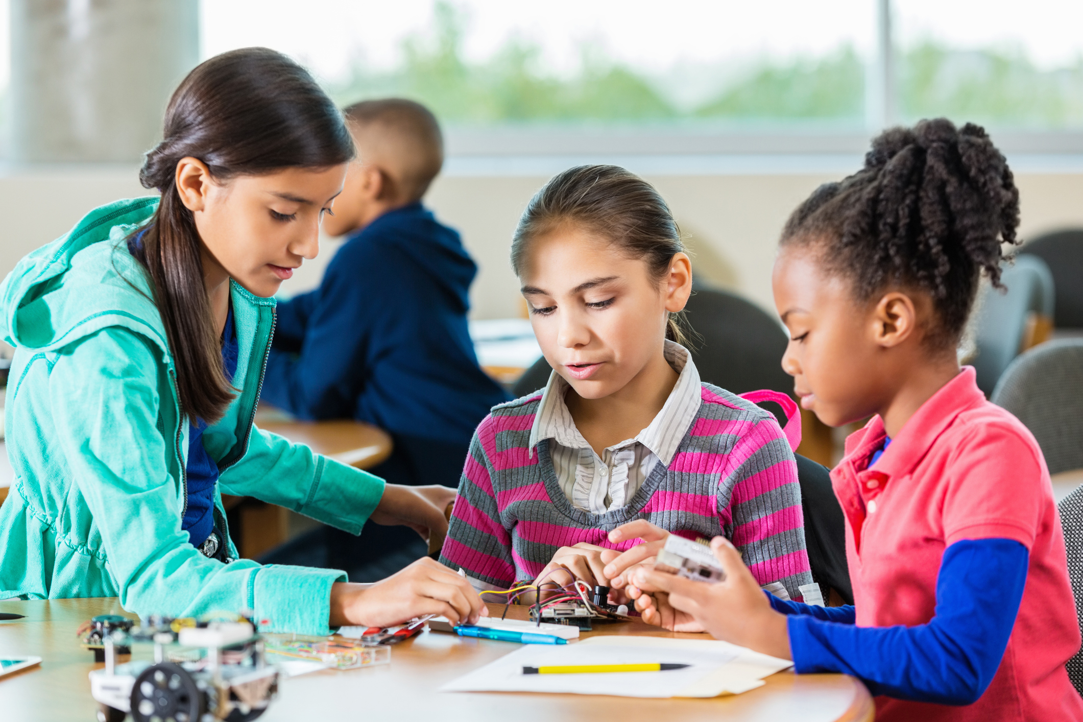 Proud multiethnic schoolboy smiling at elementary school