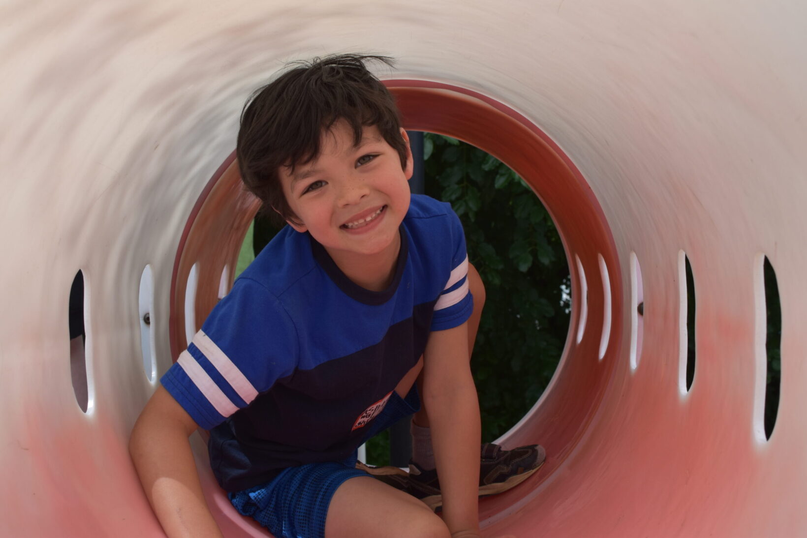 Elementary student smiling while playing at Lake Michigan Academy, a Grand Rapids private school for students with learning differences